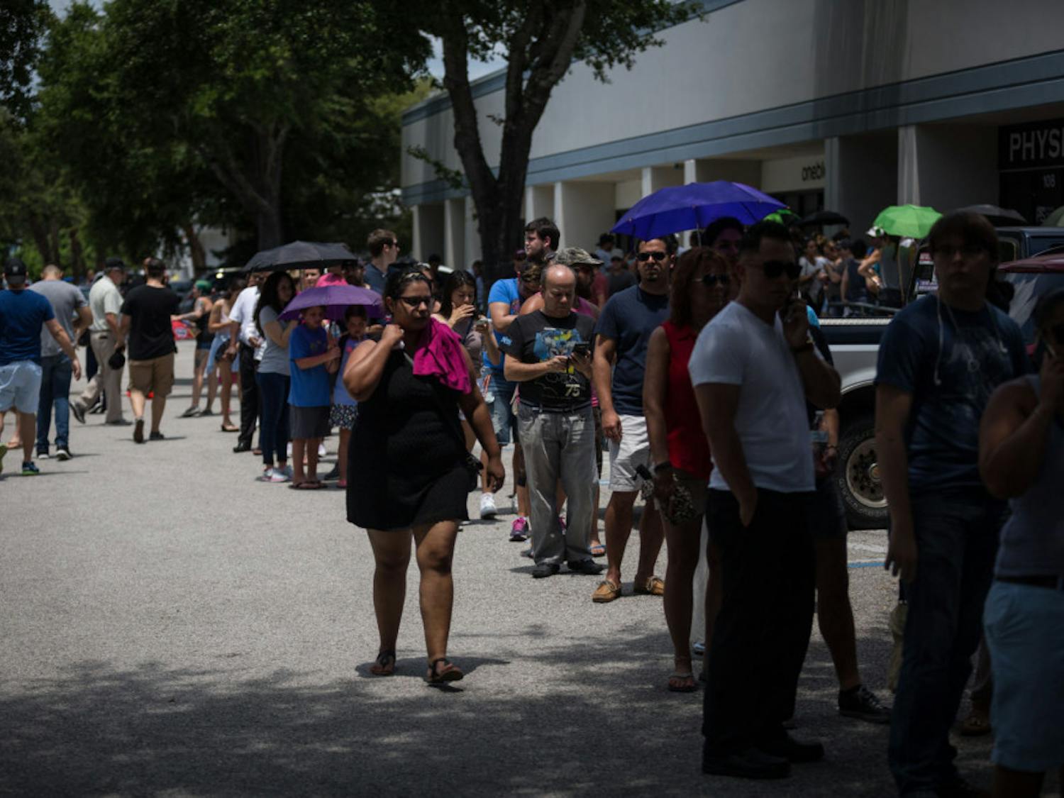 Donors line up outside OneBlood Blood Donation Center in Orlando, Fla., on Sunday, June 12, 2016. The center was flooded with donors after a mass shooting early Sunday morning at a gay nightclub, Pulse, in Orlando. A gunman wielding an assault-type rifle and a handgun opened fire inside the nightclub early Sunday, killing at least 50 people before dying in a gunfight with SWAT officers, police said. It was the worst mass shooting in American history. (Loren Elliott/Tampa Bay Times via AP)