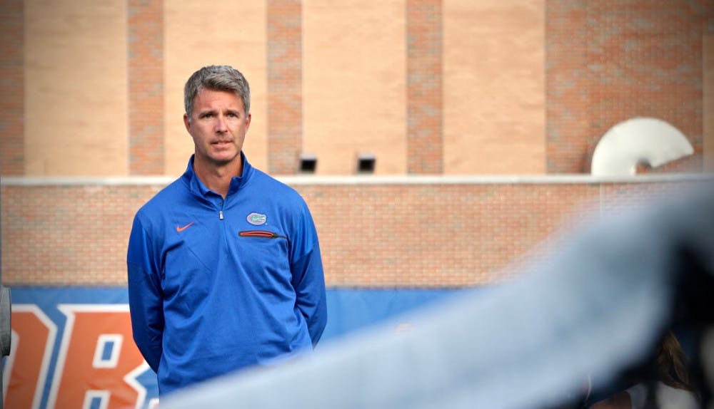 <p>UF coach Roland Thornqvist looks on during Florida's 4-2 win against Oklahoma State on Feb. 18, 2017, at the Ring Tennis Complex.</p>
