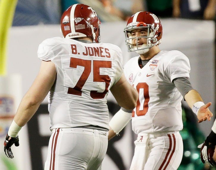 Alabama's AJ McCarron (10) and Barrett Jones argue during the second half of the BCS National Championship college football game against Notre Dame Monday, Jan. 7, 2013, in Miami. (AP Photo/David J. Phillip)