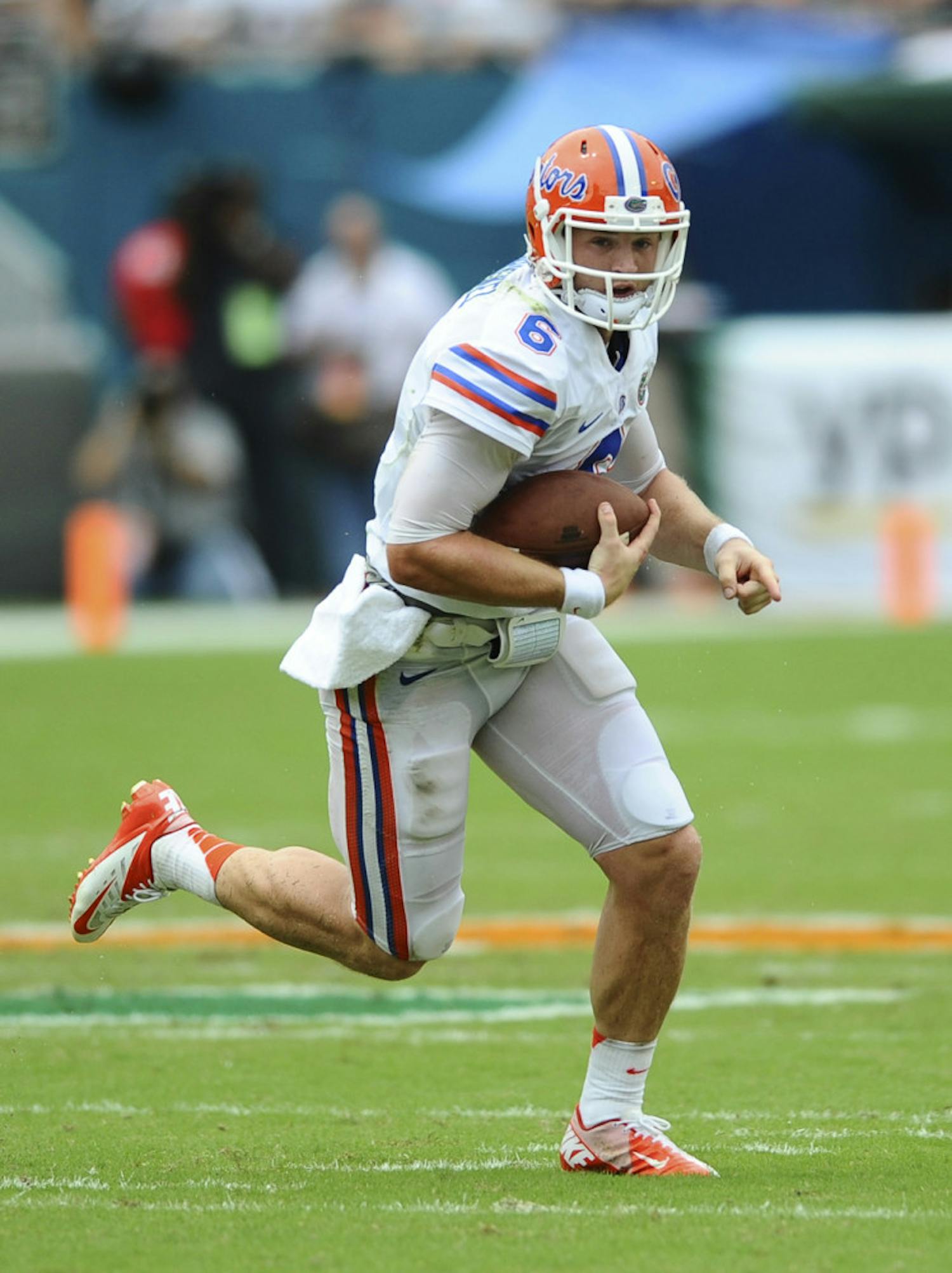 Jeff Driskel rushes during Florida’s 21-16 loss to Miami on Saturday in Sun Life Stadium. Driskel suffered a knee sprain in the game but is expected to face Tennessee on Sept. 21.