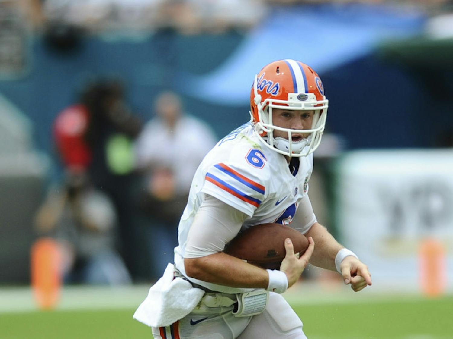 Jeff Driskel rushes during Florida’s 21-16 loss to Miami on Saturday in Sun Life Stadium. Driskel suffered a knee sprain in the game but is expected to face Tennessee on Sept. 21.