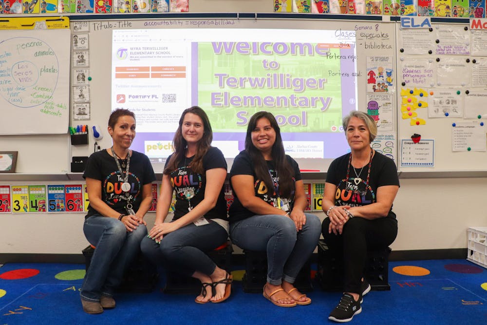  Dual language teachers Mayte Ambite-Calvo, Desiree DiPerna, Gabby Smolenski and Ana Zuber sit at the front of Ambite-Calvo's classroom at Terwilliger Elementary School on Friday, Sept. 22, 2023. 