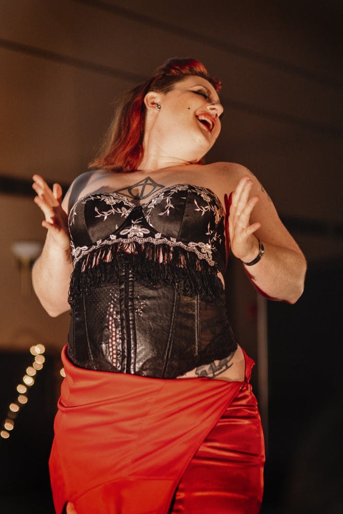 Burlesque dancer Kitty La Tuch performs a sultry routine to “Feeling Good” by Michael Buble during Pride Student Union’s Drag Ball on Oct. 16, 2015. La Tuch was among five performers who lipsynced, sang and danced to current songs in the Reitz Union grand ballroom to celebrate ‘70s and ‘80s drag culture.