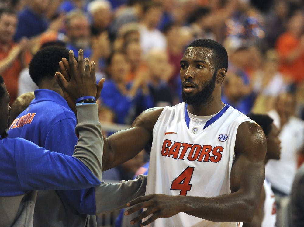 Senior center Patric Young exits the game Sunday night against Savannah State after eclipsing 1,000 career points in the second half. Young became the 50th Gators player to reach the milestone.