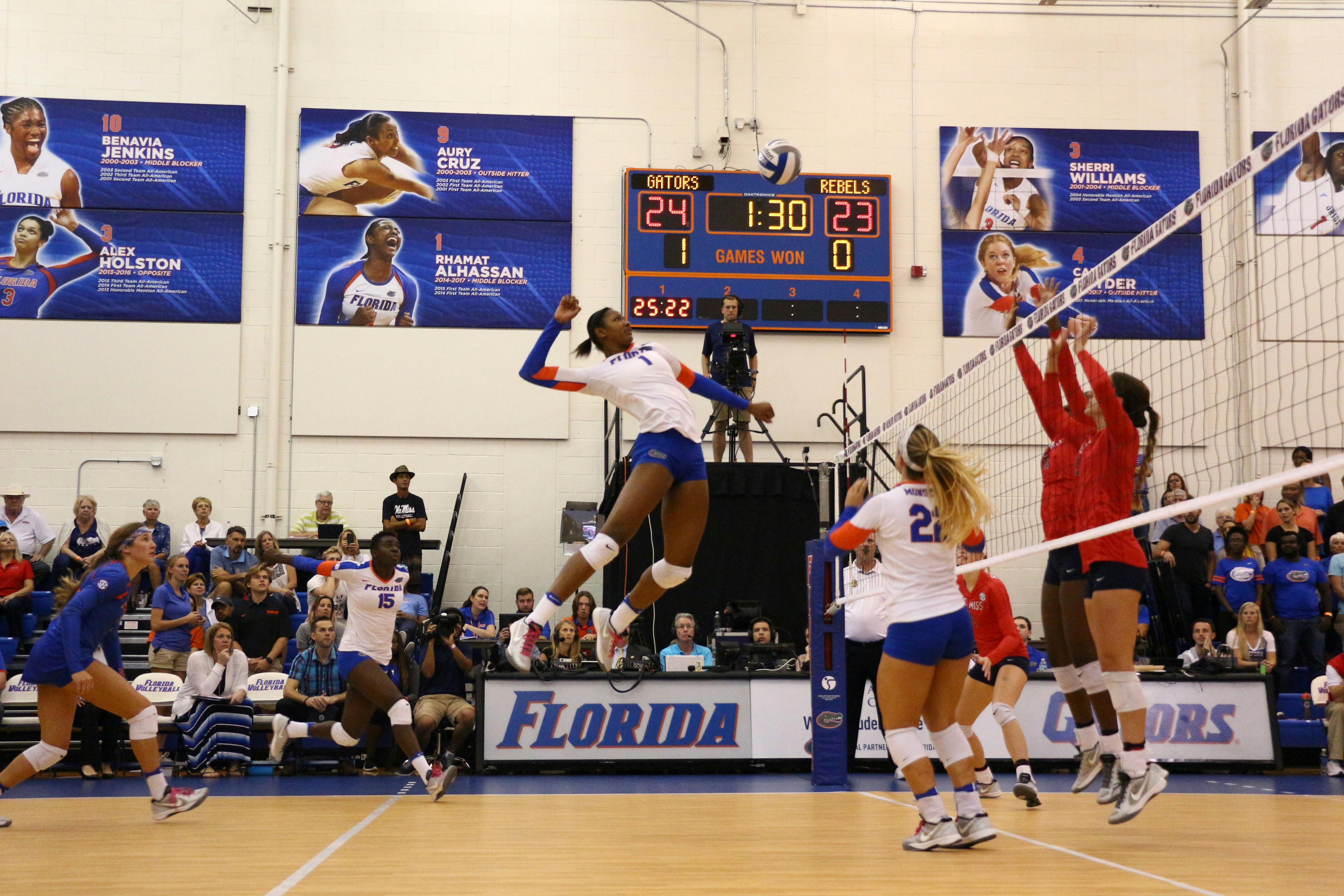Rhamat Alhassan (center) jumps for a kill during Florida's 3-0 win over Ole Miss on Oct. 28, 2016, in the Lemerand Center.