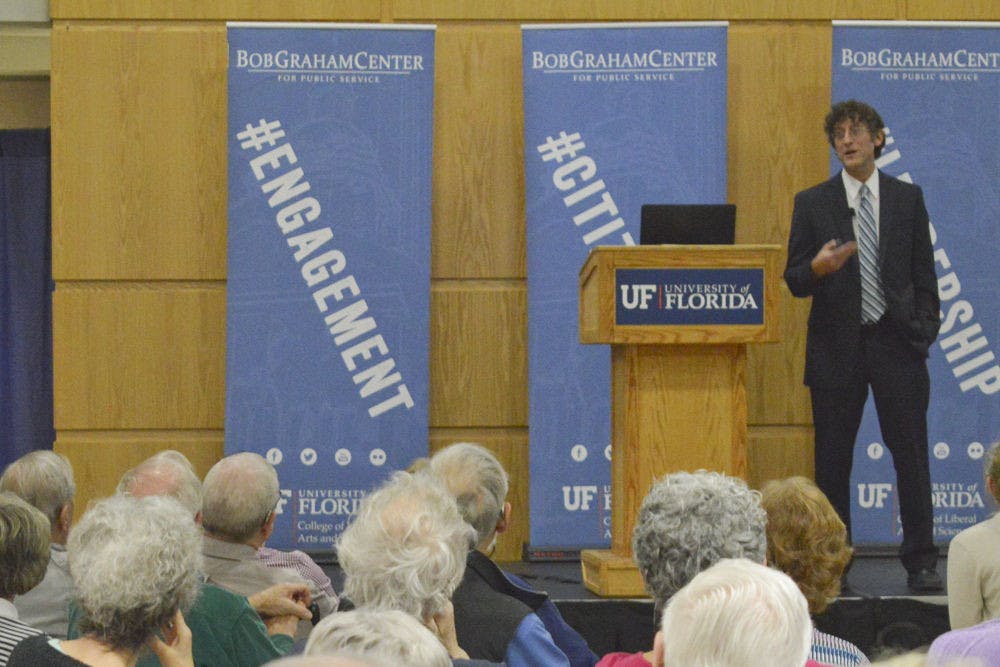 Jonathan Oberlander, professor of Social Medicine at the University of North Carolina at Chapel Hill, discusses the details of the Affordable Care Act, Medicare and health care reform to a full audience at the Bob Graham Center on Tuesday. "Maybe the most important thing to understand about the Affordable Care Act is that, in a fundamental way, it is incremental," Oberlander said. "Yes, it is ambitious – it does things that we have never done in this country before."