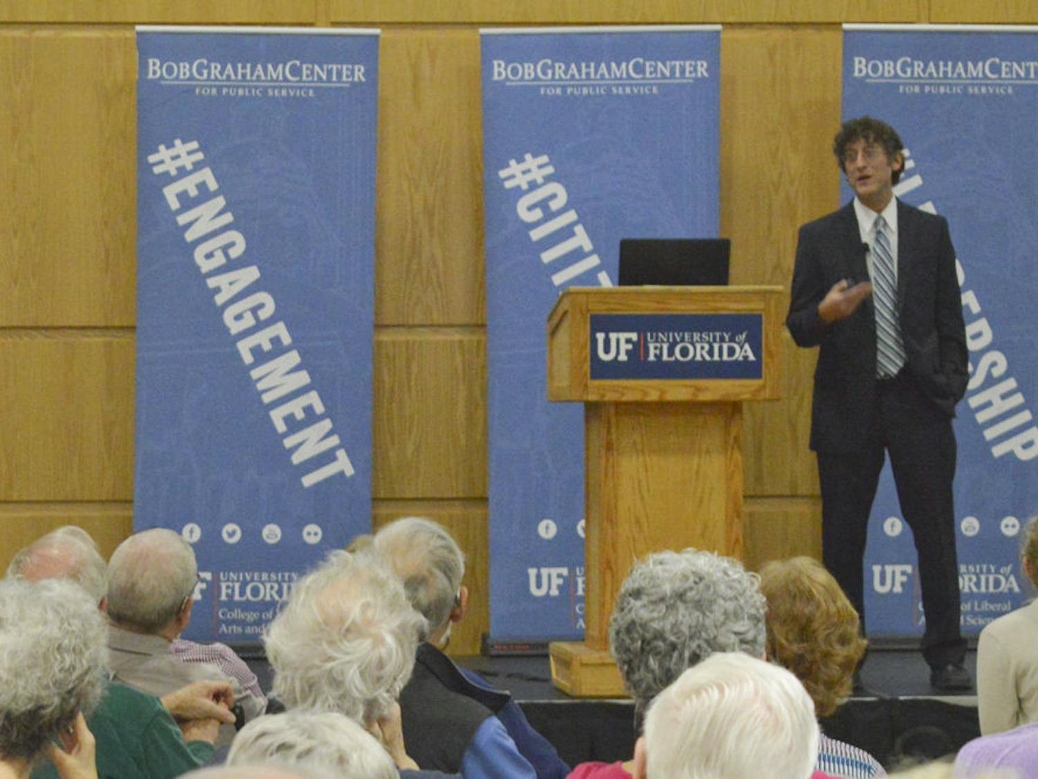 Jonathan Oberlander, professor of Social Medicine at the University of North Carolina at Chapel Hill, discusses the details of the Affordable Care Act, Medicare and health care reform to a full audience at the Bob Graham Center on Tuesday. "Maybe the most important thing to understand about the Affordable Care Act is that, in a fundamental way, it is incremental," Oberlander said. "Yes, it is ambitious – it does things that we have never done in this country before."