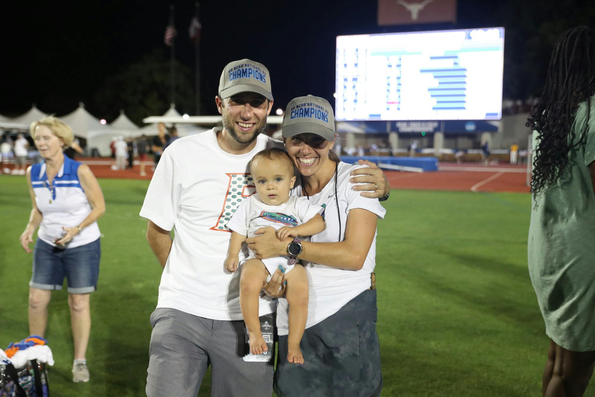 Will and Samantha Palmer pose with their son Liam during the Gators' National Championship meet Friday, June 9, 2023 at Mike Myers Stadium in Austin, Texas.