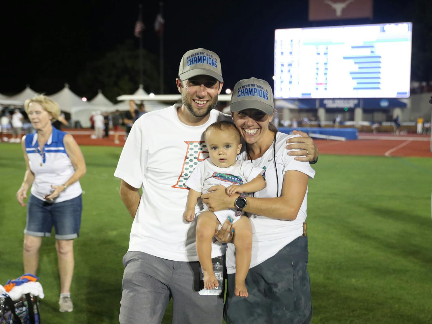Will and Samantha Palmer pose with their son Liam during the Gators' National Championship meet Friday, June 9, 2023 at Mike Myers Stadium in Austin, Texas.