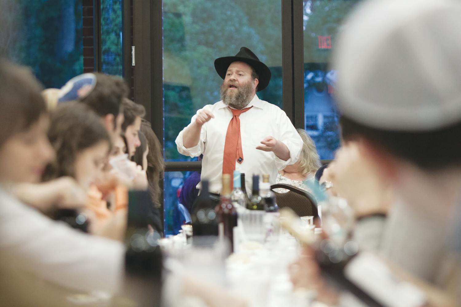 Rabbi Berl Goldman, a director of the Lubavitch Chabad Jewish Center, speaks to about 600 people before officially starting Passover at about 8 p.m. on Monday. 