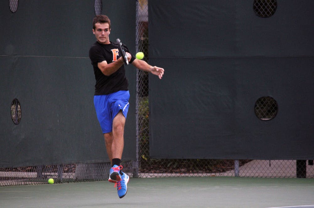 <p>Chase Perez-Blanco returns a ball during Florida's 4-1 win against Mississippi State on March 13 at the Ring Tennis Complex.</p>