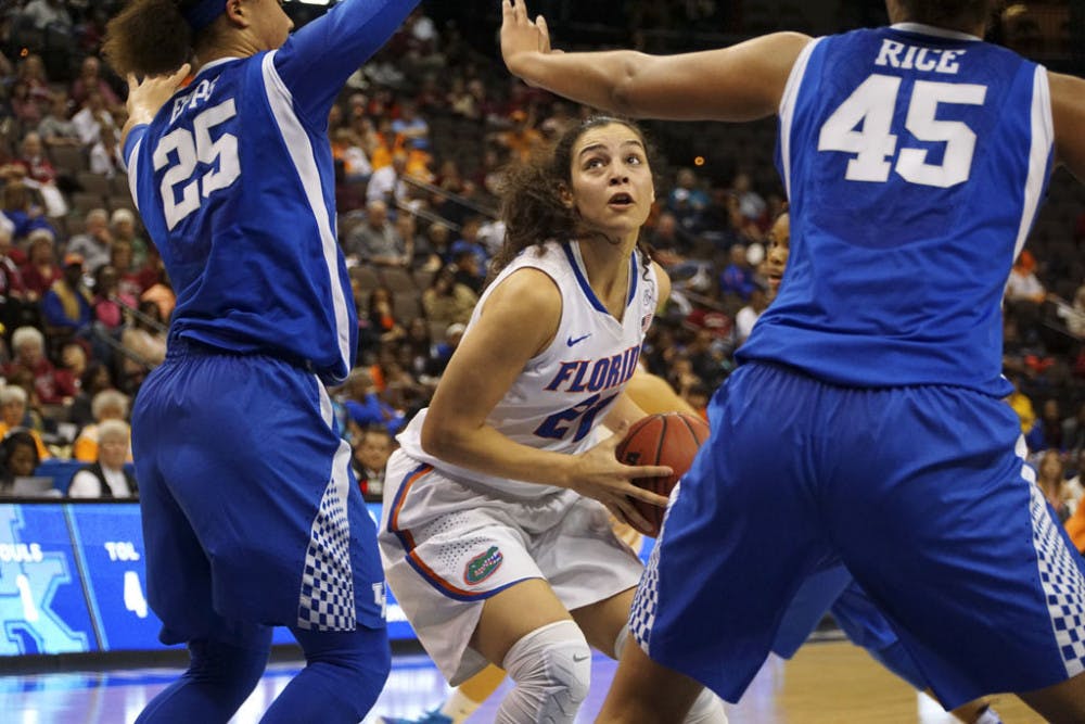 <p>Eleanna Christinaki looks to drive to the basket while two Kentucky players defend her during Florida's 92-69 loss to the Wildcats in the SEC Tournament quarterfinals on March 4, 2016, in Jacksonville.</p>