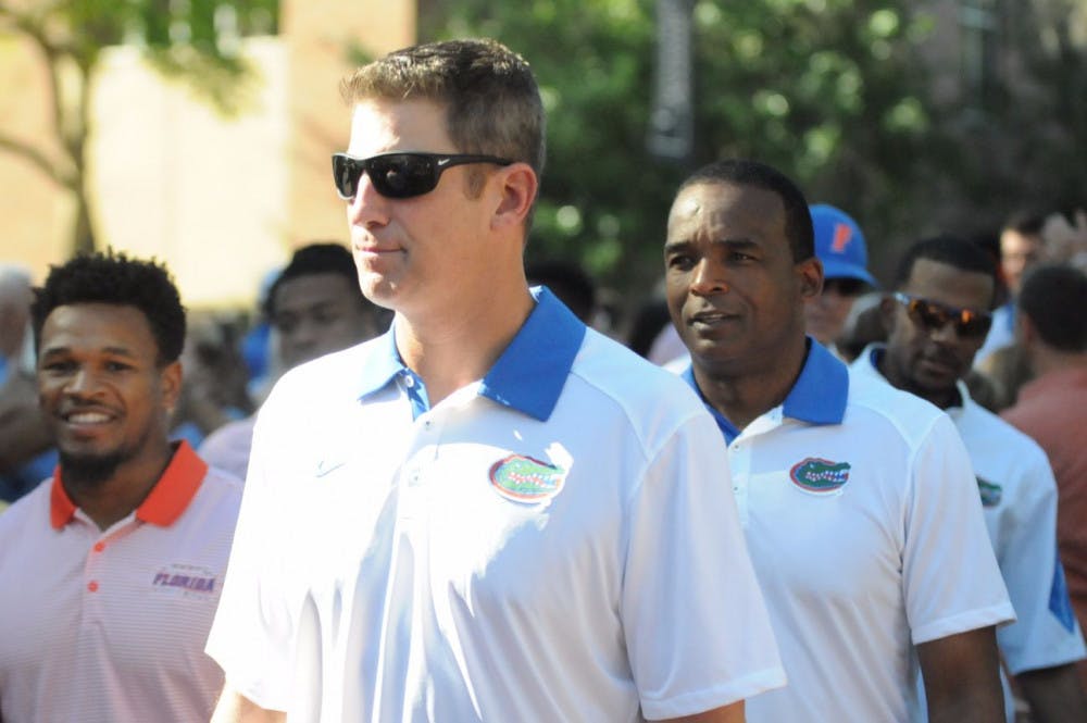 <p>UF offensive coordinator Doug Nussmeier&nbsp;participates in Florida's Gator Walk prior to&nbsp;the Orange &amp; Blue Debut on April 8, 2016, at Ben Hill Griffin Stadium.</p>