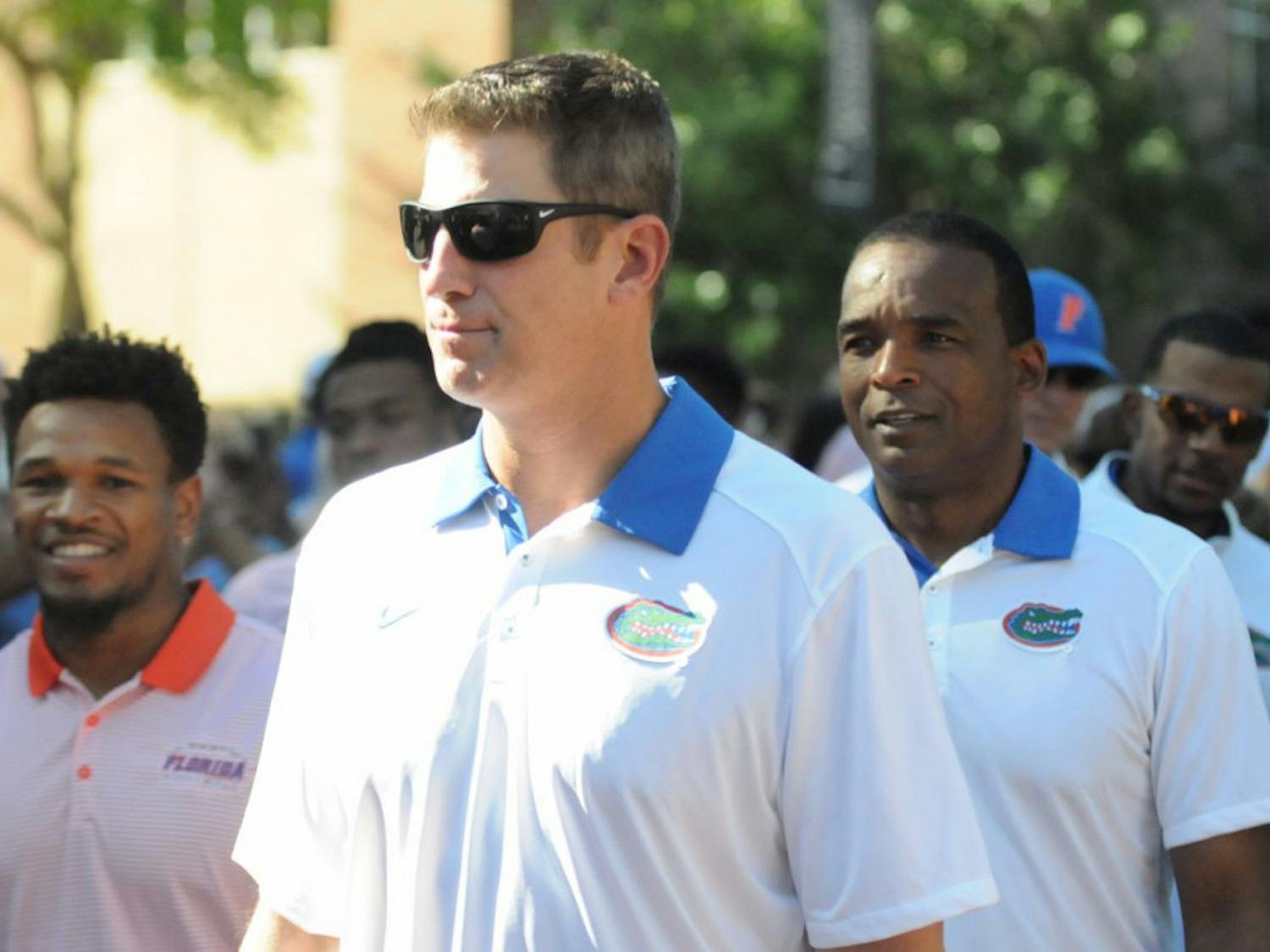 UF offensive coordinator Doug Nussmeier participates in Florida's Gator Walk prior to the Orange & Blue Debut on April 8, 2016, at Ben Hill Griffin Stadium.