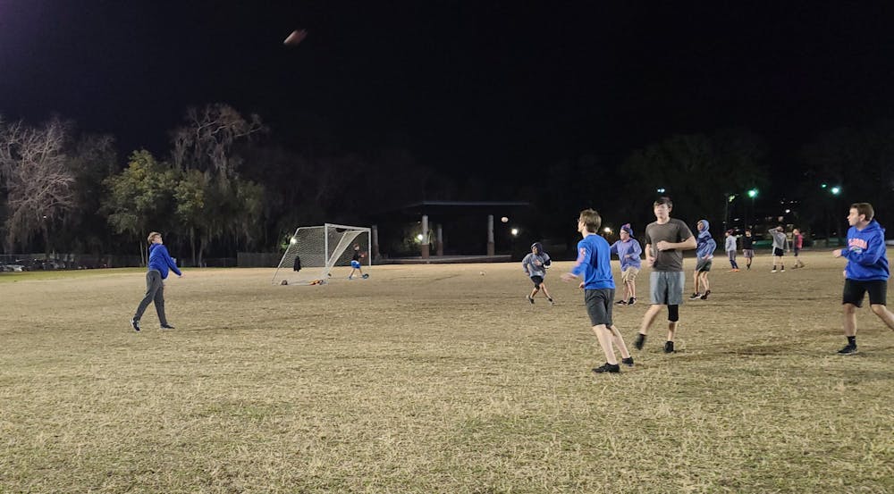 Freshman Campbell Harmon throws a shot during a quick Sunday-night pickup football game.