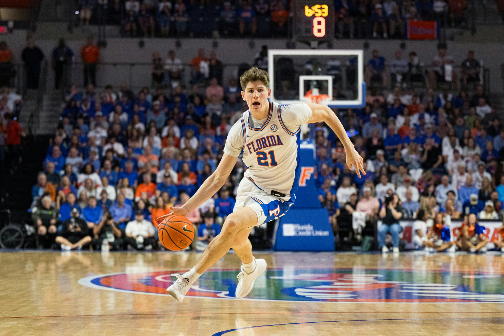 Florida Gators forward/center Alex Condon (21) dribbles the ball in a basketball game against Texas A&M on Saturday, Mar. 1, 2025, in Gainesville, Fla.