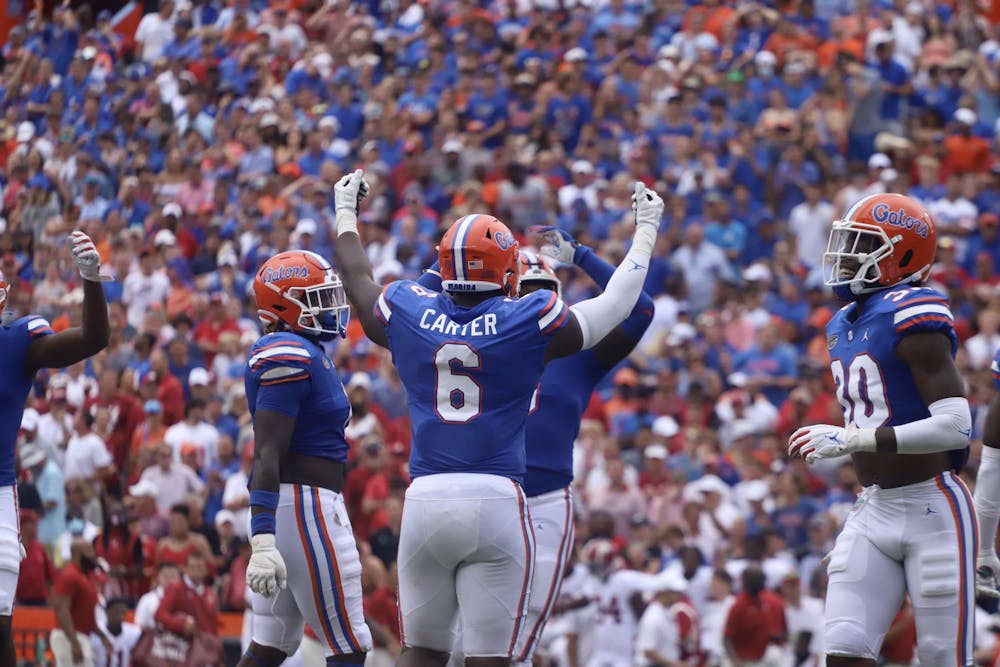 <p>Florida defensive lineman Zachary Carter hypes up the crowd during Florida&#x27;s 31-29 loss to No. 1 Alabama on Sept. 18. Carter was drafted by the Cincinnati Bengals Friday in the third round of the NFL Draft.</p>