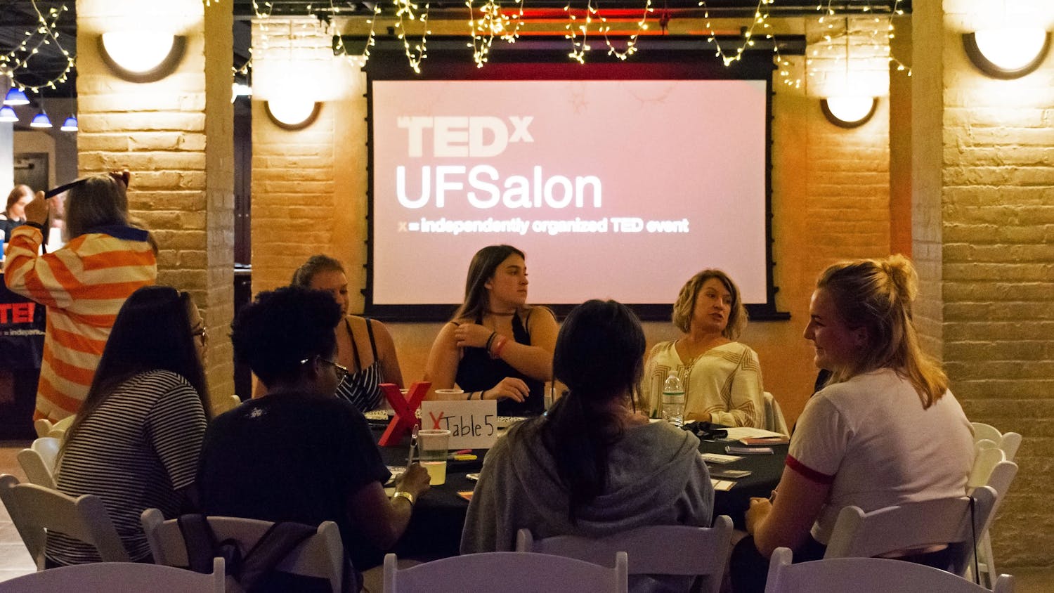 UF students and Gainesville community members gather Tuesday evening to discuss inclusivity at TEDxUF's first salon of the semester, titled "Who Tells the Story".