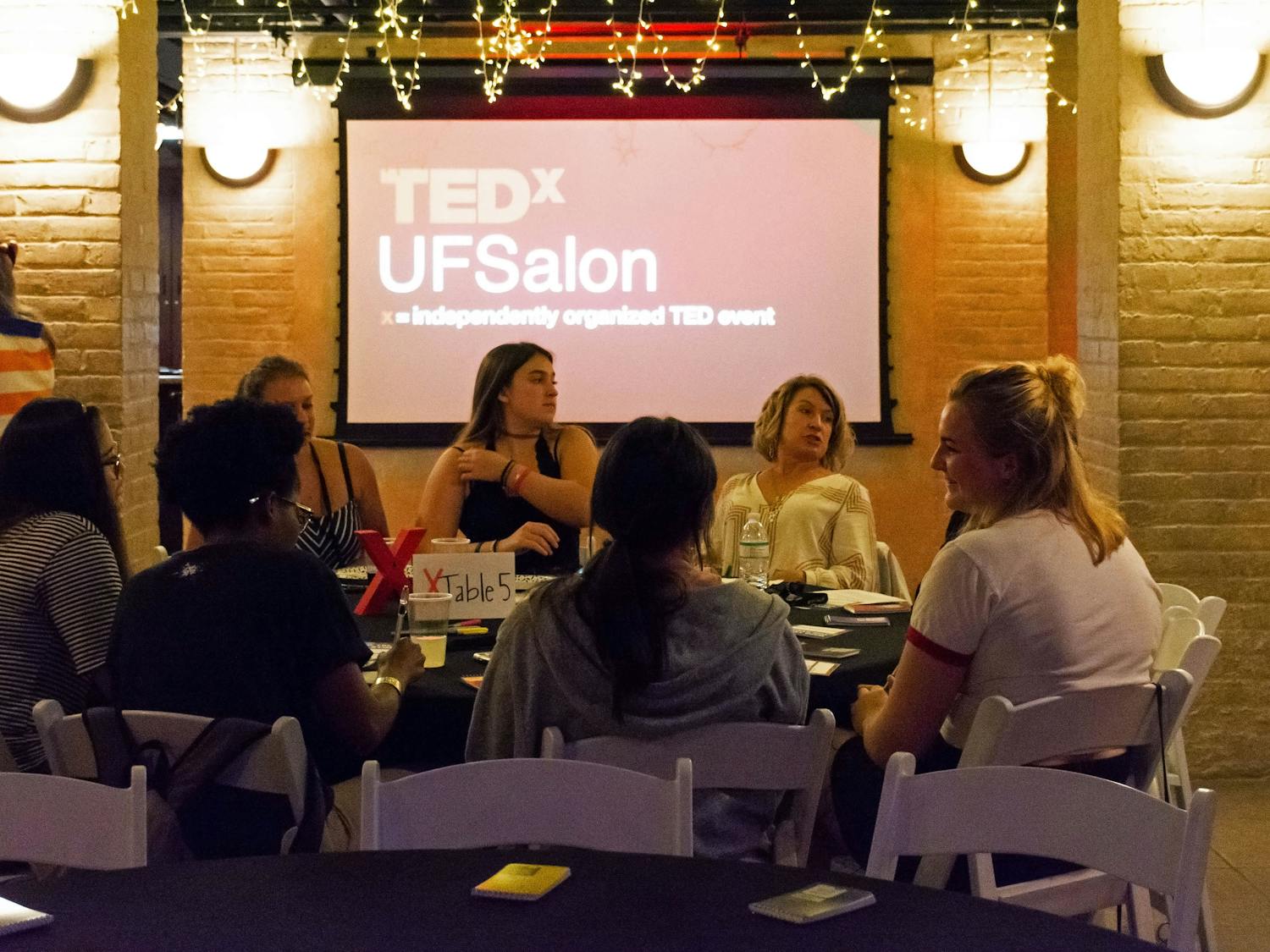 UF students and Gainesville community members gather Tuesday evening to discuss inclusivity at TEDxUF's first salon of the semester, titled "Who Tells the Story". 