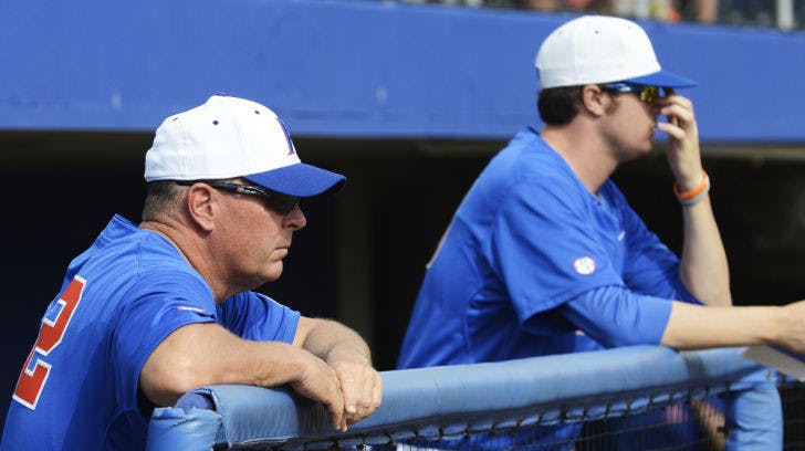 Coach Brad Weitzel watches from the dugout during Florida’s 7-4 loss to Florida Gulf Coast on Feb. 24 at McKethan Stadium. FGCU and Indiana have each defeated UF in weekend series at McKethan Stadium this season. The Gators won every weekend series against non-conference opponents during the 2012 campaign.
