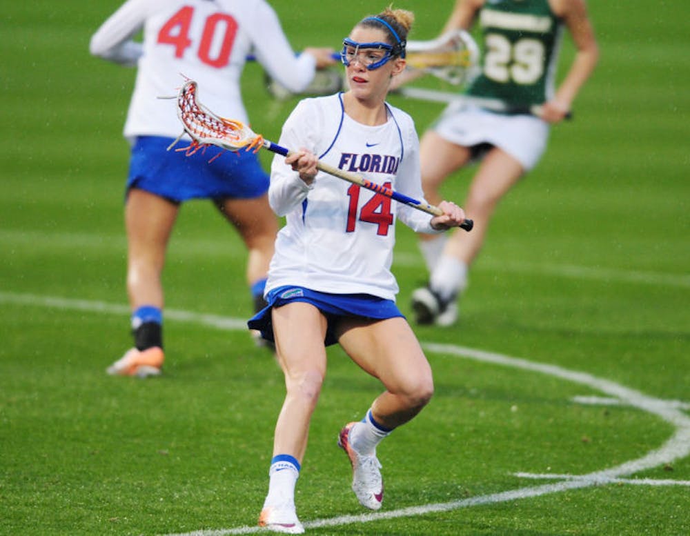 <p>Nora Barry drives toward the ball during Florida’s 21-5 win against Jacksonville on Feb. 12 at Donald R. Dizney Stadium. Barry had one assist in Florida’s 13-9 win against Penn State on Sunday.</p>