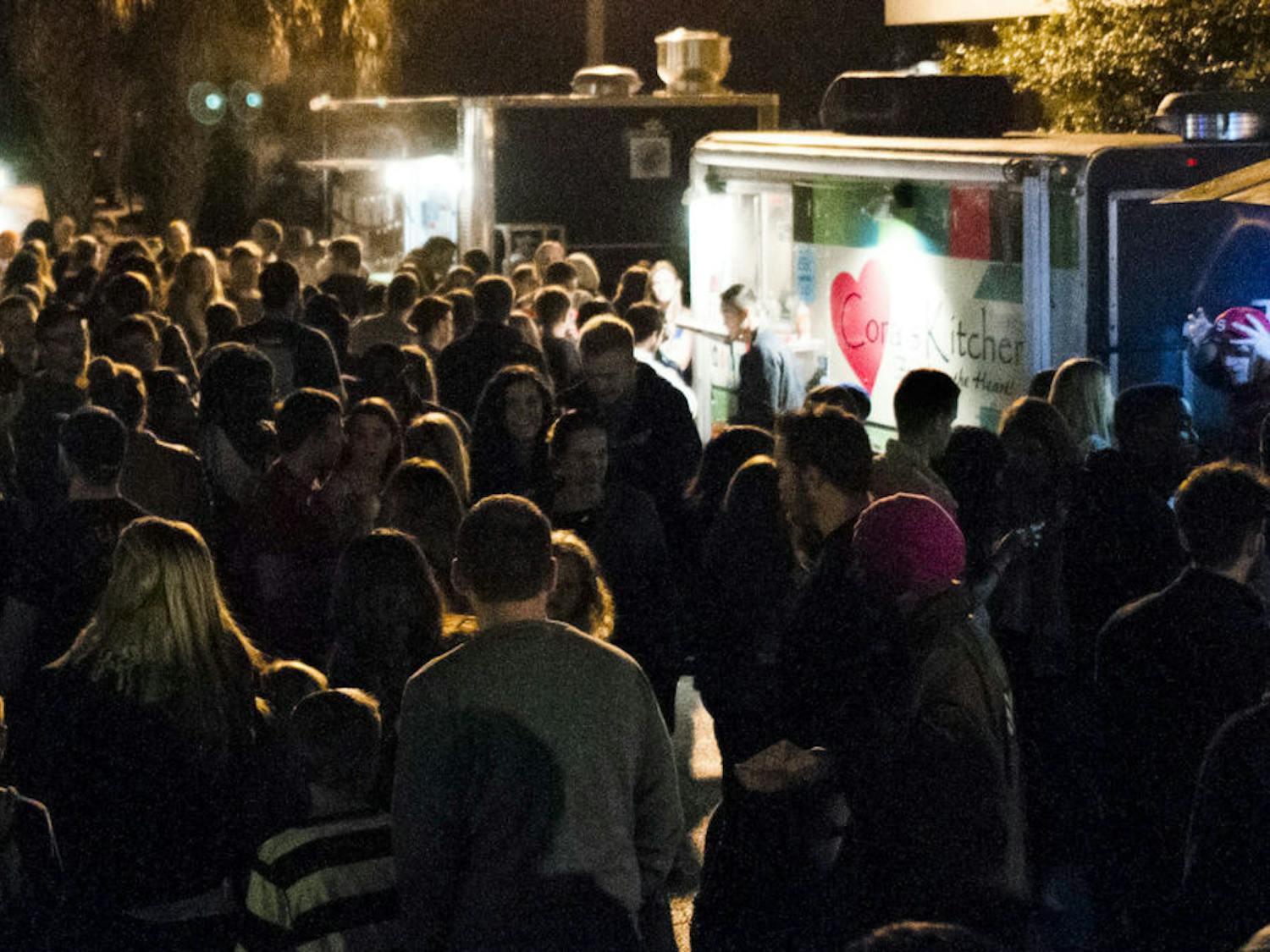 Attendees wait in line for Cora's Kitchen food truck at the third-annual Original Gainesville Food Truck rally in January, 2016.