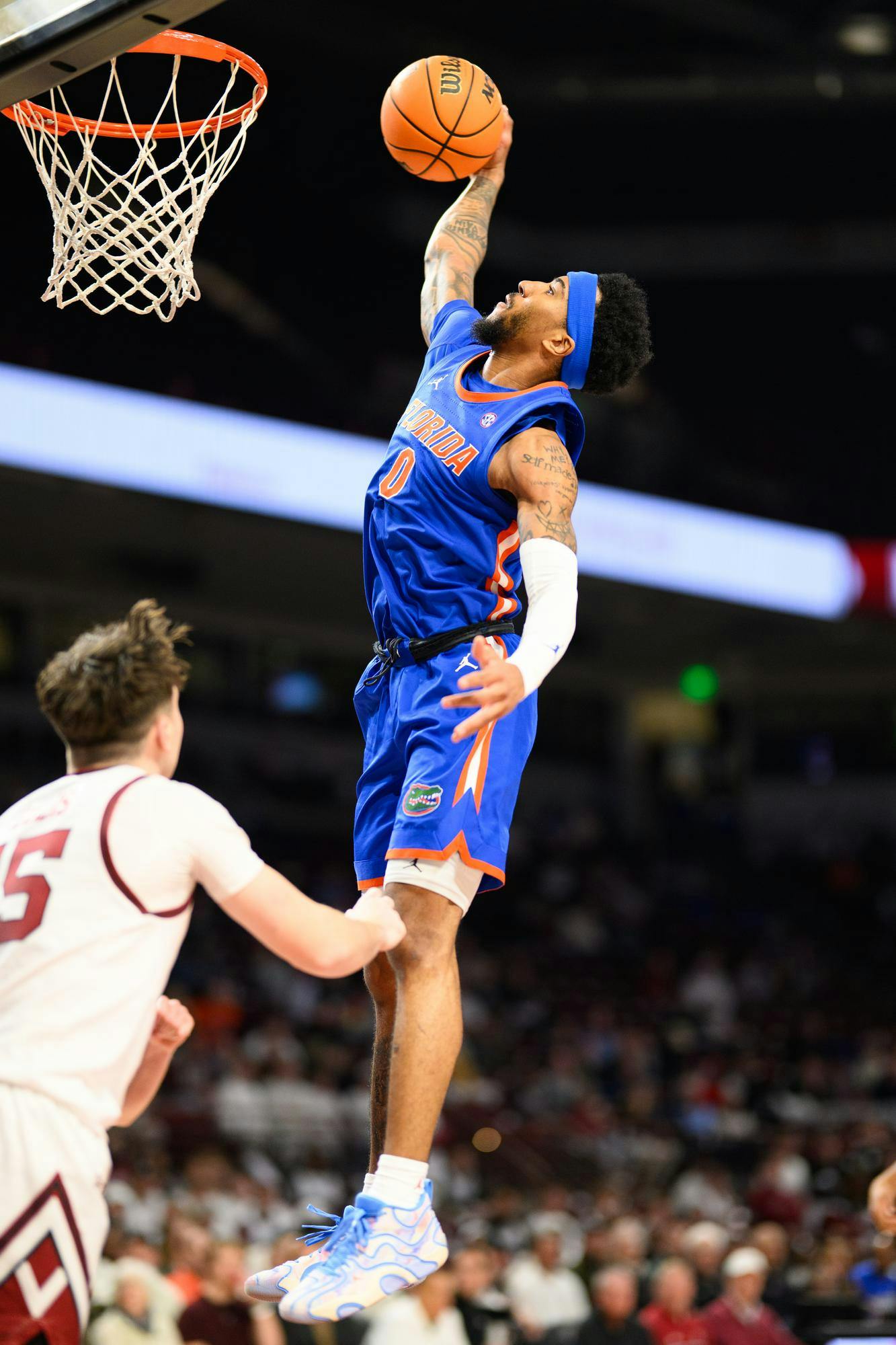 Florida guard Boogie Fland (0) dunks during the second half of an NCAA college basketball game against South Carolina, Wednesday, Jan. 28, 2026, in Columbia, S.C.