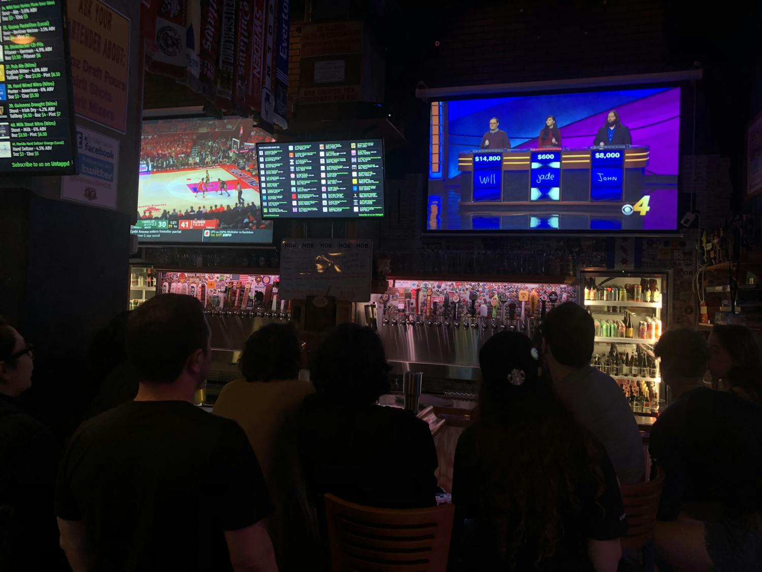 Jade Ryan, a 25-year-old UF English senior, and her friends watch her compete on "Jeopardy!" Tuesday night at House of Beer, at 19 W. University Ave. 