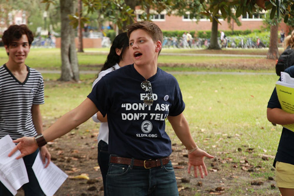 <p>Lauren Hannahs, 27, director of LGBT affairs for UF, hosts a rally celebrating the repeal of "Don't Ask, Don't Tell" on Plaza of the Americas on Tuesday.</p>