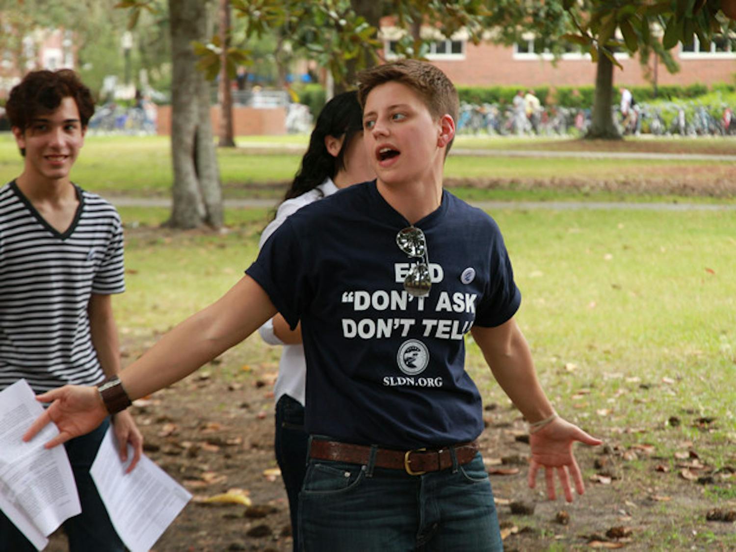 Lauren Hannahs, 27, director of LGBT affairs for UF, hosts a rally celebrating the repeal of "Don't Ask, Don't Tell" on Plaza of the Americas on Tuesday.