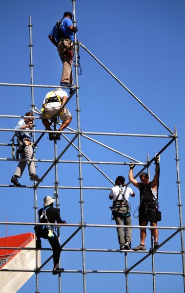Construction workers build the stage for Gator Growl, the largest student-run pep rally in the country that takes place Friday night. They’ve been working since Sunday.