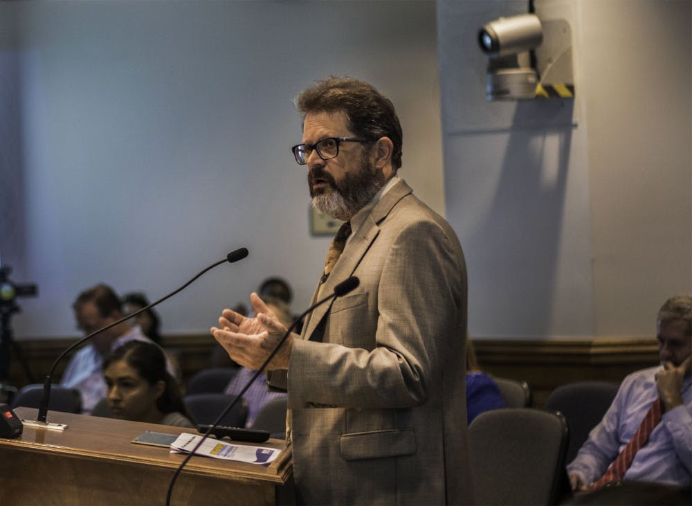 Gainesville Regional Utilities general manager Edward Bielarski Jr discusses increasing electric rates with the Gainesville City Commission on Wednesday during a meeting. Gas rates will increase by 0.57 percent, wastewater by 0.42 percent and water by 0.44 percent.