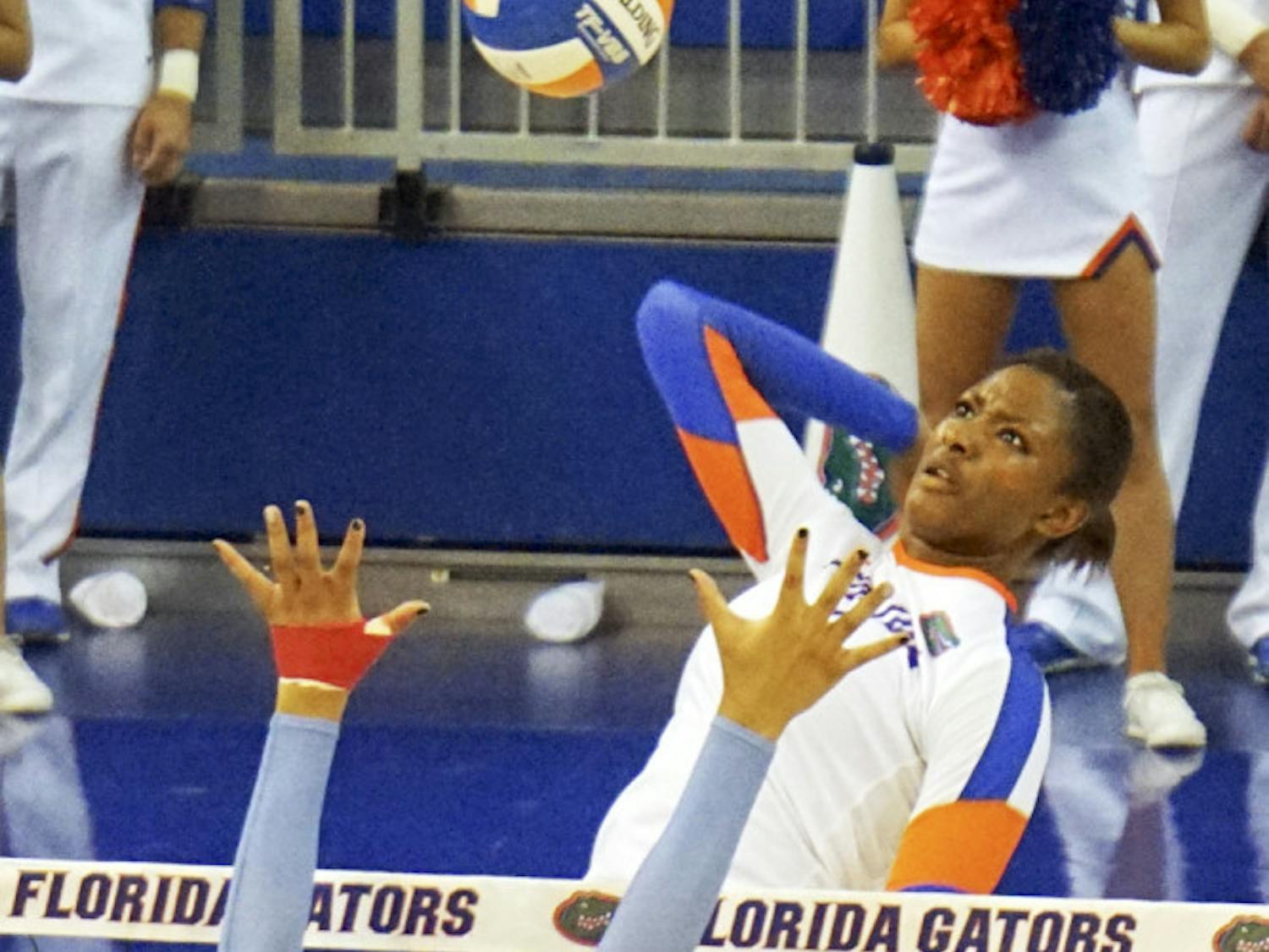 UF middle blocker Rhamat Alhassan swings for a kill during Florida's 3-0 win against Ole Miss on Sept. 25 in the O'Connell Center.