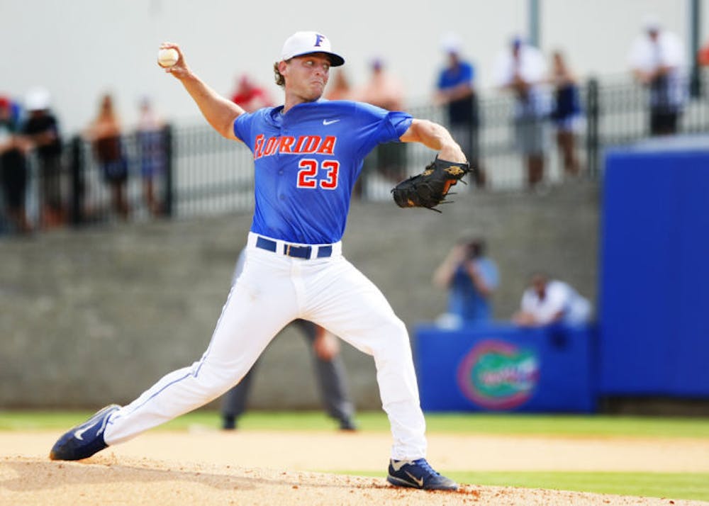 <p>Junior Jonathon Crawford throws a pitch during Florida’s 9-8 victory against NC State in Game 2 of the NCAA Gainesville Super Regional on June 10, 2012, at McKethan Stadium.&nbsp;</p>