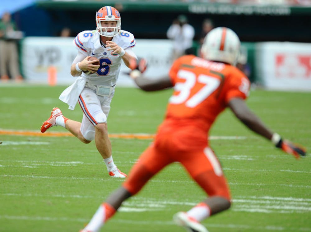 <p>Jeff Driskel runs the ball during Florida’s 21-16 loss to Miami on Sept. 7 in Sun Life Stadium. Driskel is the Gators’ starting quarterback heading into the season, but the backup remains unknown for now.</p>