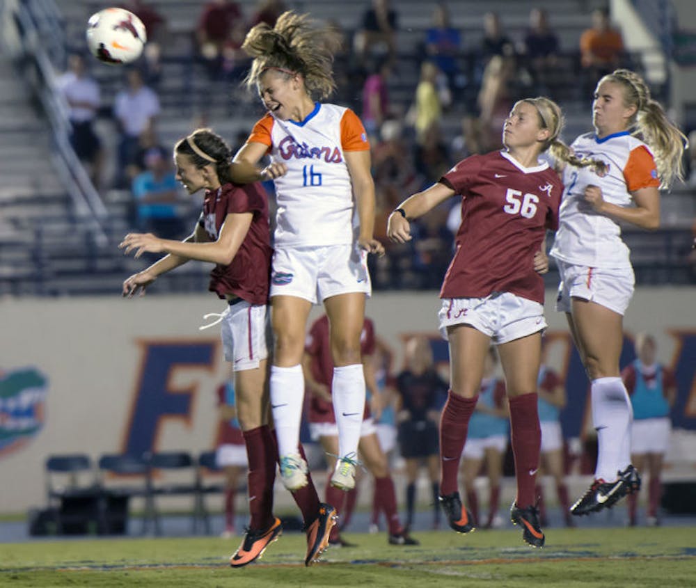 <p>Liz Slattery heads the ball during Florida’s Southeastern Conference opener, a 3-0 victory against Alabama on Friday at James G. Pressly Stadium. UF’s freshmen have 15 of the Gators’ 21 goals this season.</p>