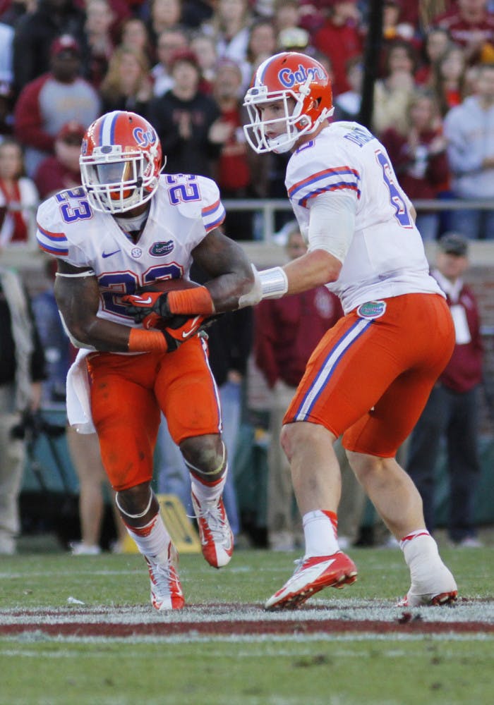 Mike Gillislee (23) takes a handoff from quarterback Jeff Driskel (6) against FSU on Nov. 24. Gillislee ran for 1,152 yards in 2012.