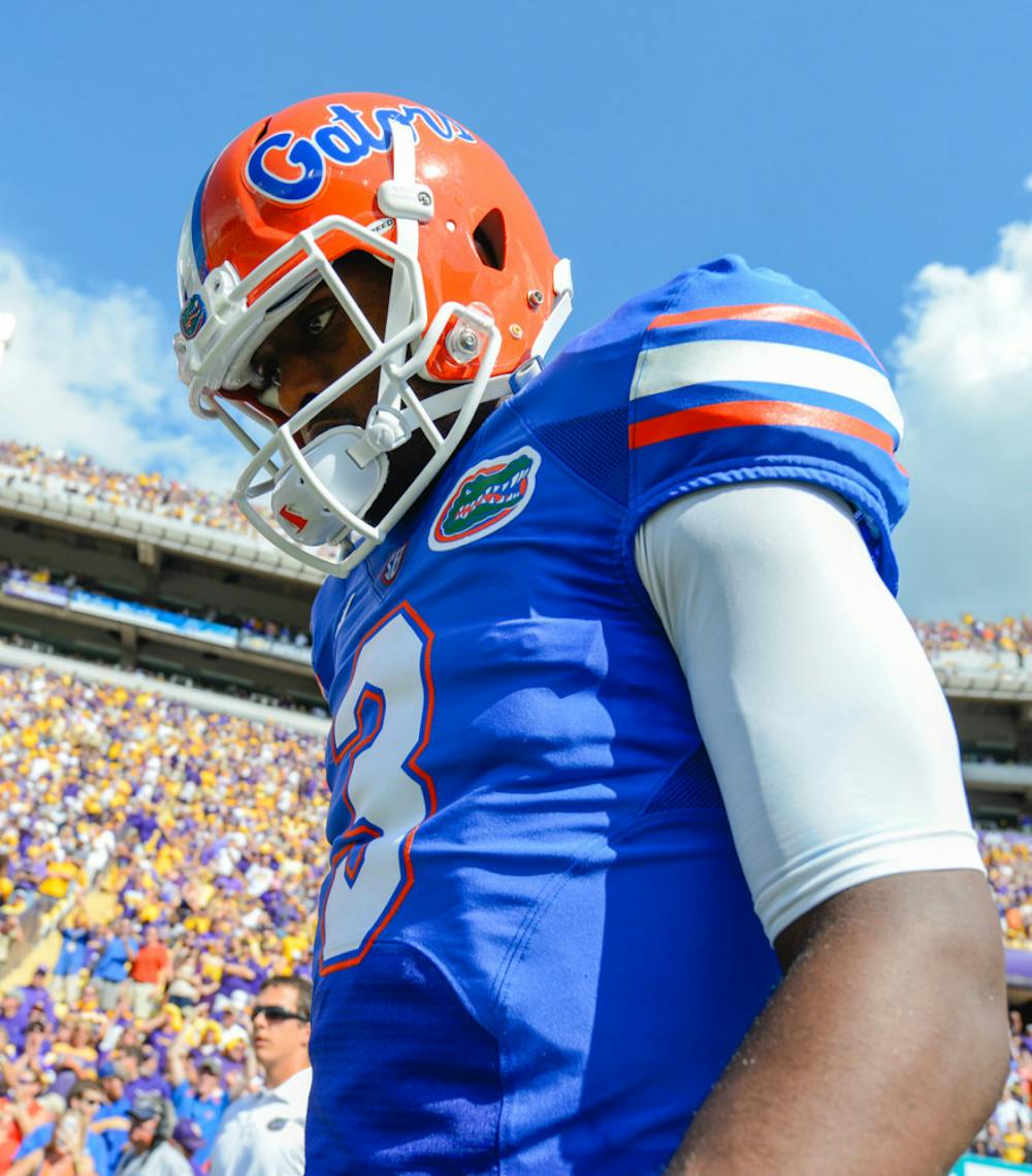<p align="justify">Tyler Murphy heads to the field before playing LSU at Tiger Stadium in Baton Rouge, La., on Oct. 12, 2013. Murphy announced he was transferring from Florida on Dec. 15. 2013, after starting six games for the Gators during a 4-8 season.</p>