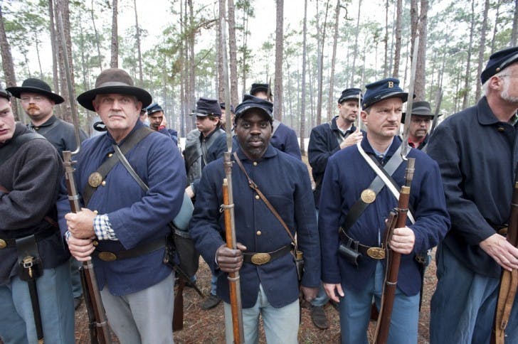 Edgar McCray, of the 54th Regiment Massachusetts Volunteer Infantry, stands in formation during an afternoon inspection Saturday.
&nbsp;