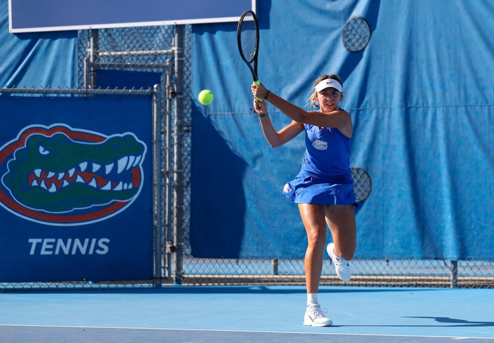 Florida’s Lucie Pawlak hits the ball during an NCAA women’s doubles tennis match against Maria Andrienko and Amina Salibayeva of Alabama, March 26, 2026, in Gainesville, Fla.