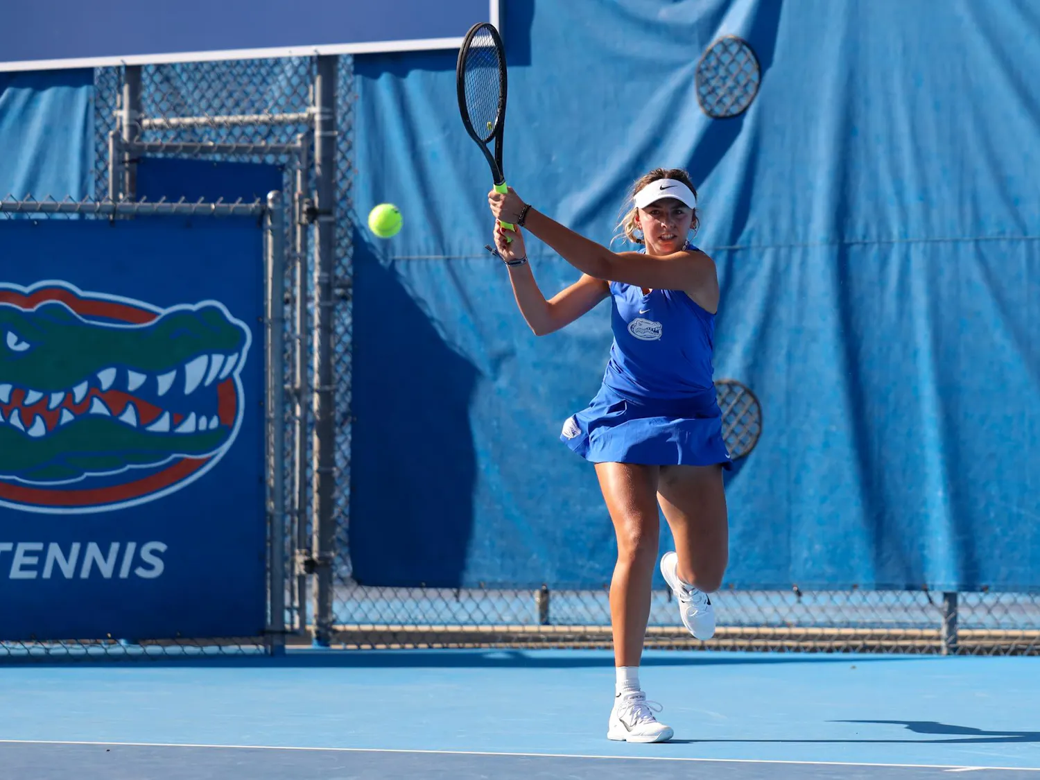 Florida’s Lucie Pawlak hits the ball during an NCAA women’s doubles tennis match against Maria Andrienko and Amina Salibayeva of Alabama, March 26, 2026, in Gainesville, Fla.