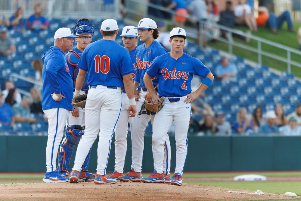Florida head coach Kevin O’Sullivan stands at the mound for a ptiching change during an NCAA baseball game against Jacksonville University, Tuesday, March 31, 2026, in Gainesville, Fla.