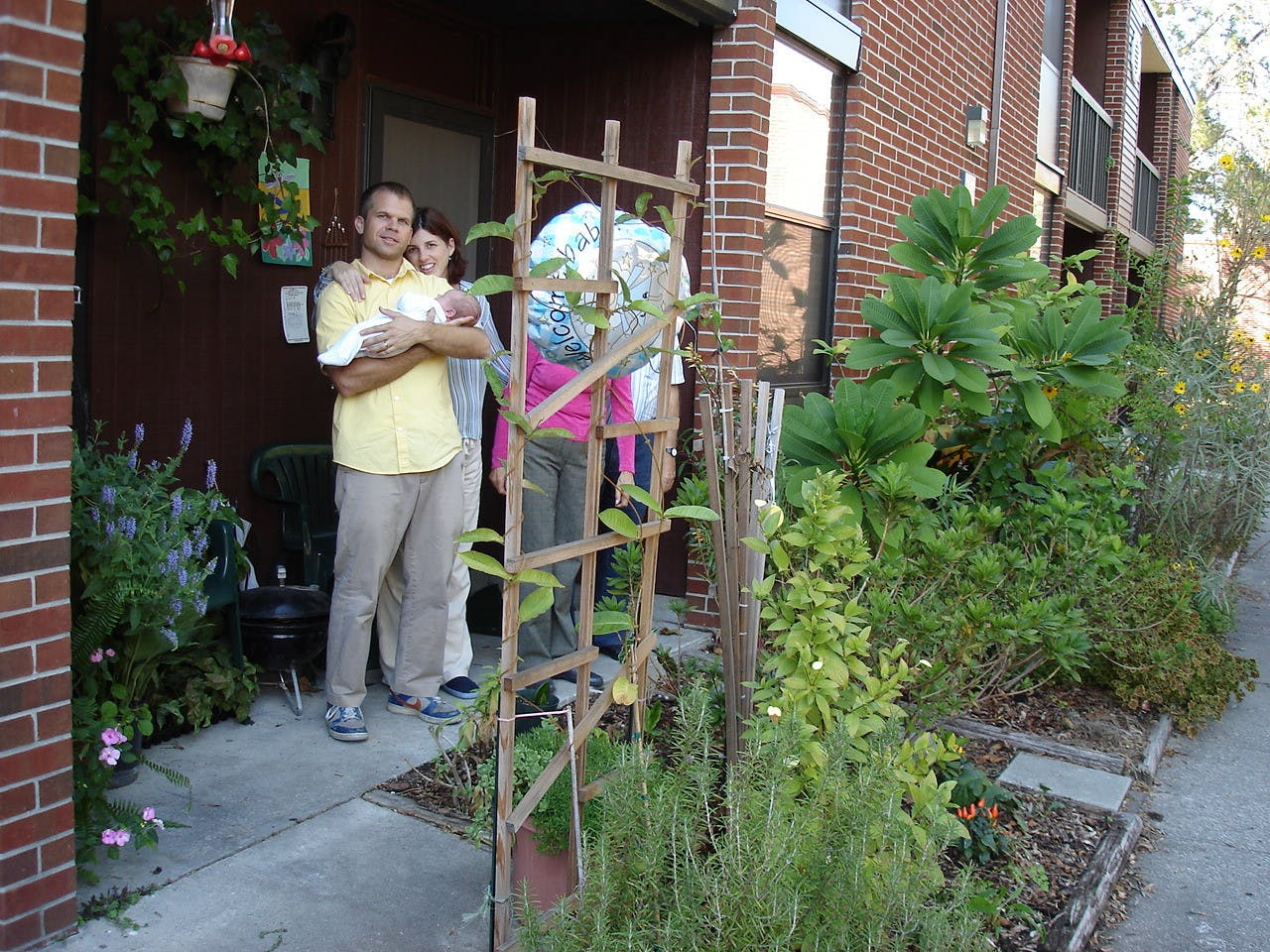 McNair Bostick (left), Luca Bostick-Valero (center) and Carmen Valero-Aracama (right) pictured at their home in University Village South. 