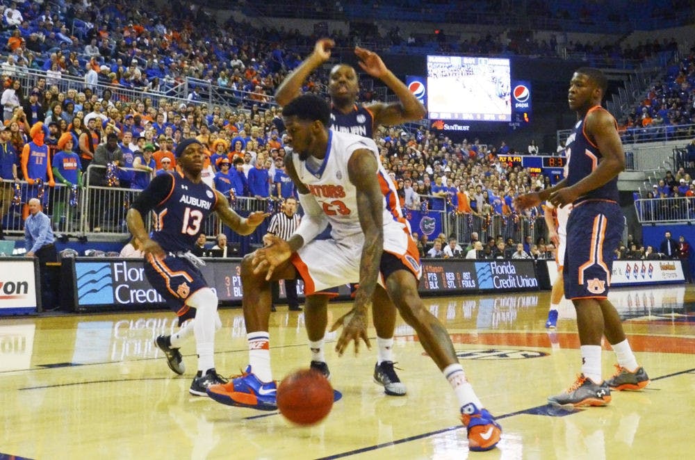 UF sophomore center Chris Walker dribbles during Florida's 75-55 win against Auburn on Thursday in the O'Connel Center.