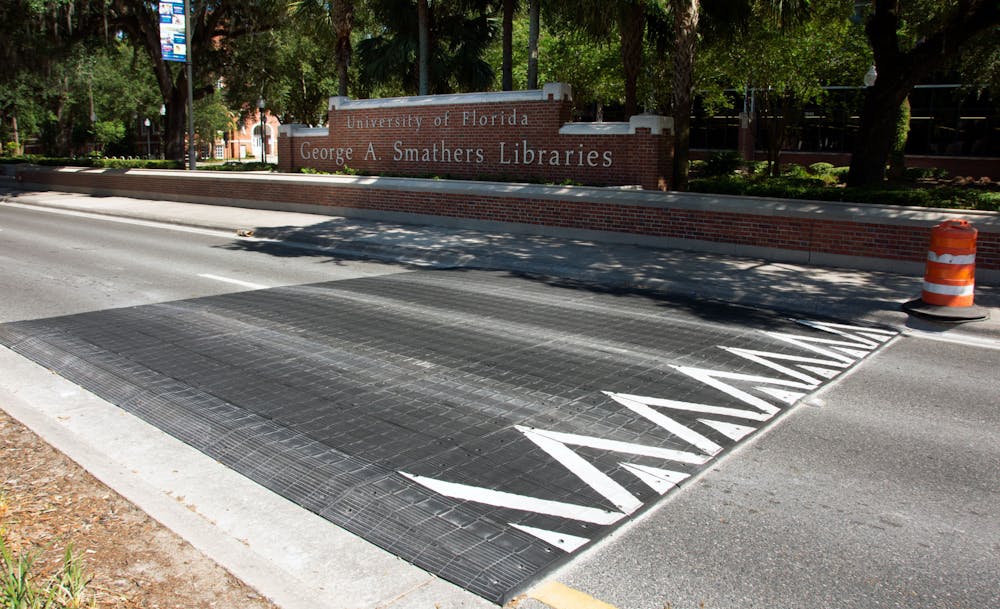 A new speed table rests outside the George A. Smathers Libraries at UF on Saturday, May 8, 2021. Speed tables were installed between Northwest 13th Street and Northwest 22nd Street in response to community outcry over recent traffic deaths on University Avenue. (Photo by Sam Schaffer)
