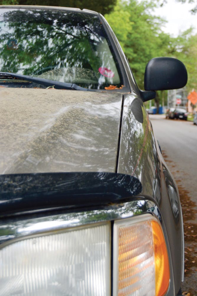 Pictured is the hood of a pickup truck covered in pollen on Southwest First Avenue.