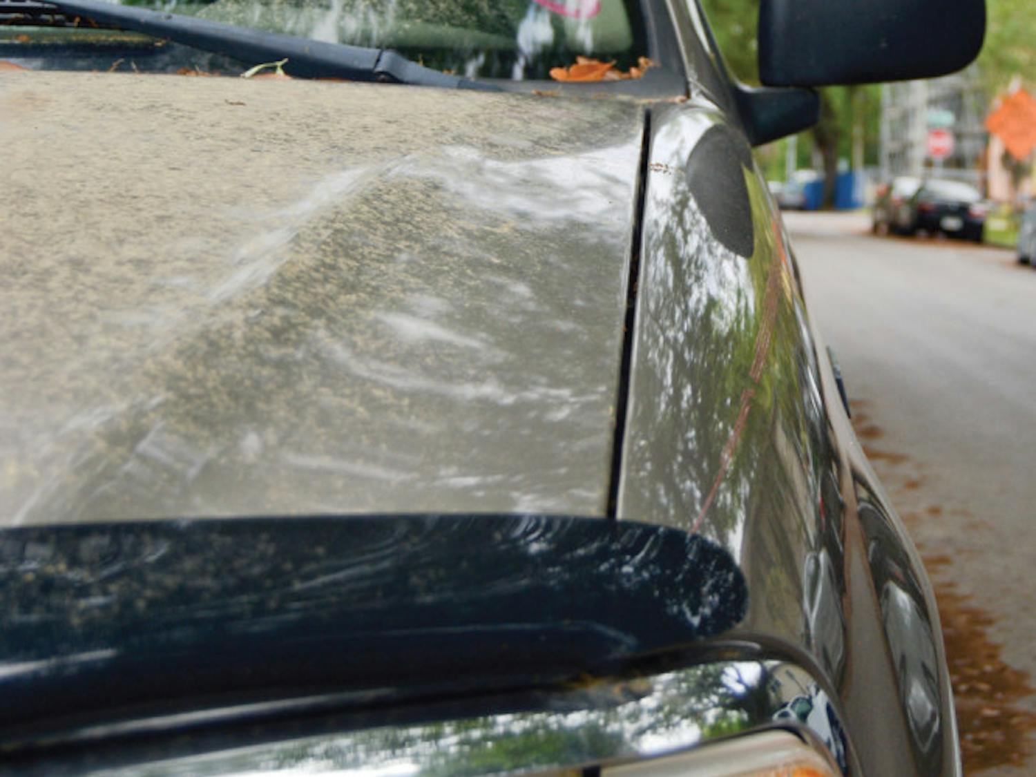 Pictured is the hood of a pickup truck covered in pollen on Southwest First Avenue.