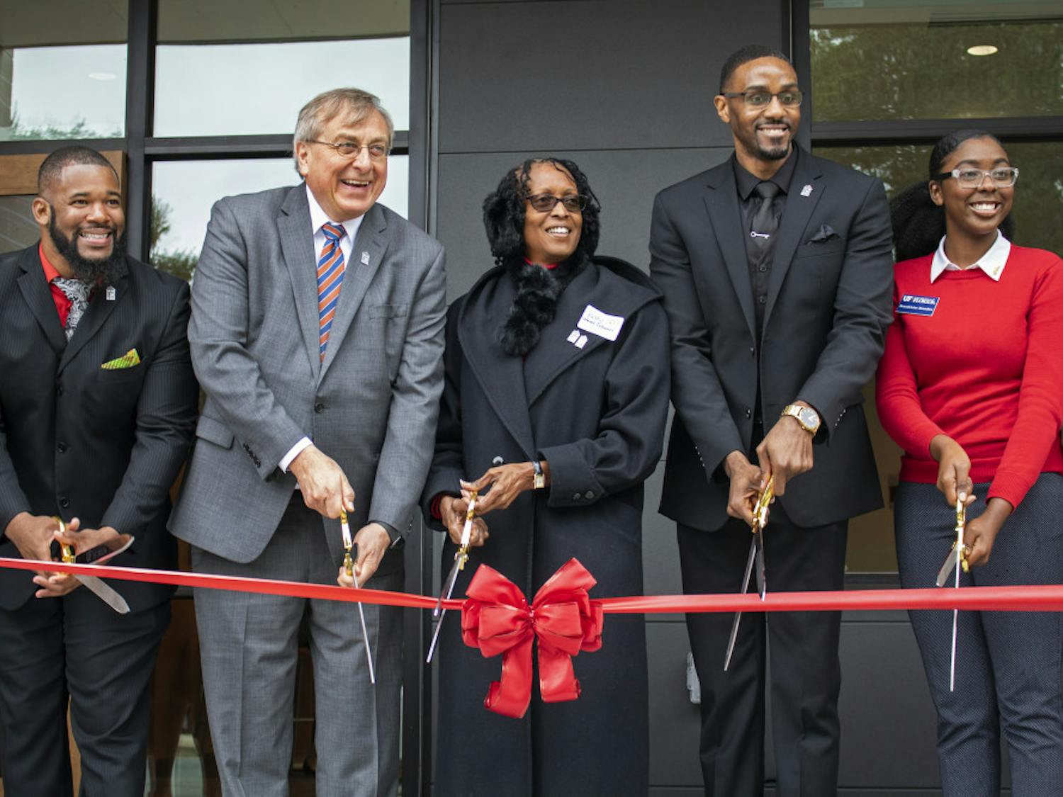 Carl Simien, UF President Kent Fuchs, Betty Stewart-Fullwood, William Atkins and Beaudelaine Mesadieu cut a ribbon Saturday, officially opening up the new Institute of Black Culture. 