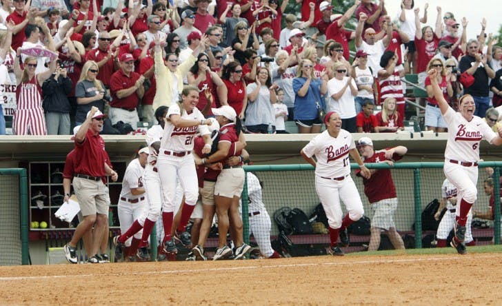 Alabama fans and players celebrate defeating Florida 10-1 in the SEC Tournament final Saturday. The Crimson Tide’s run-rule victory was their third win against the Gators in seven days.