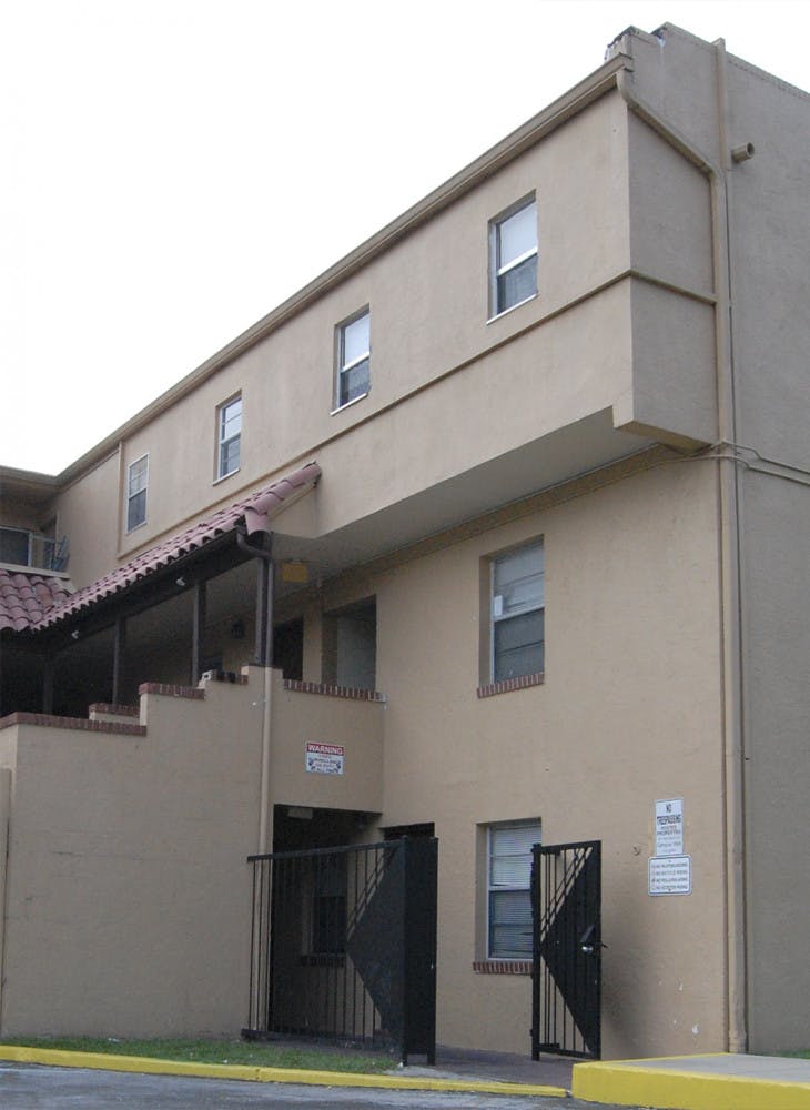 Bullet holes dot the wall at Campus Walk Apartments on Monday. Michael Dennison, 41, fired at apartment 50 on Wednesday after getting into an argument with friends. 